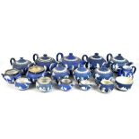 WEDGWOOD; a group of teapots, milk jugs and sucriers, all in blue jasper dip, length of largest
