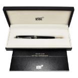 MONT BLANC; a rotating ball point pen, fitted in original box, with service book and outer box.