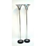 A pair of Art Deco-style floor standing chromed up lamps with trumpet shades, height approx 174cm.