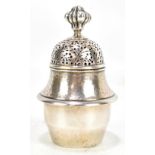 RAMSDEN & CARR; an Edward VII hallmarked silver sugar caster, the upper body with planished
