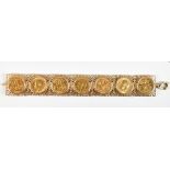 Edward VII and George V half sovereigns set in a 9ct yellow gold pierced bracelet, approx 63.25g.