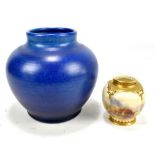 HARRY STINTON FOR ROYAL WORCESTER; a small lobed globular vase with pierced rim painted with