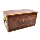 A Regency rosewood, cross banded inlaid rectangular tea caddy with twin lion mask and loop
