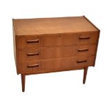 TIBERGAARD; a Danish teak chest of three drawers, raised on column supports, height 70cm.