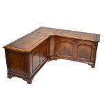 A reproduction oak three sectioned base/music centre, with four assorted doors raised on bracket and