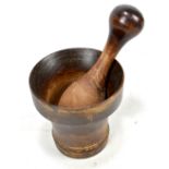 A late 19th century treen pestle and mortar, height of former 10.4cm (2)
