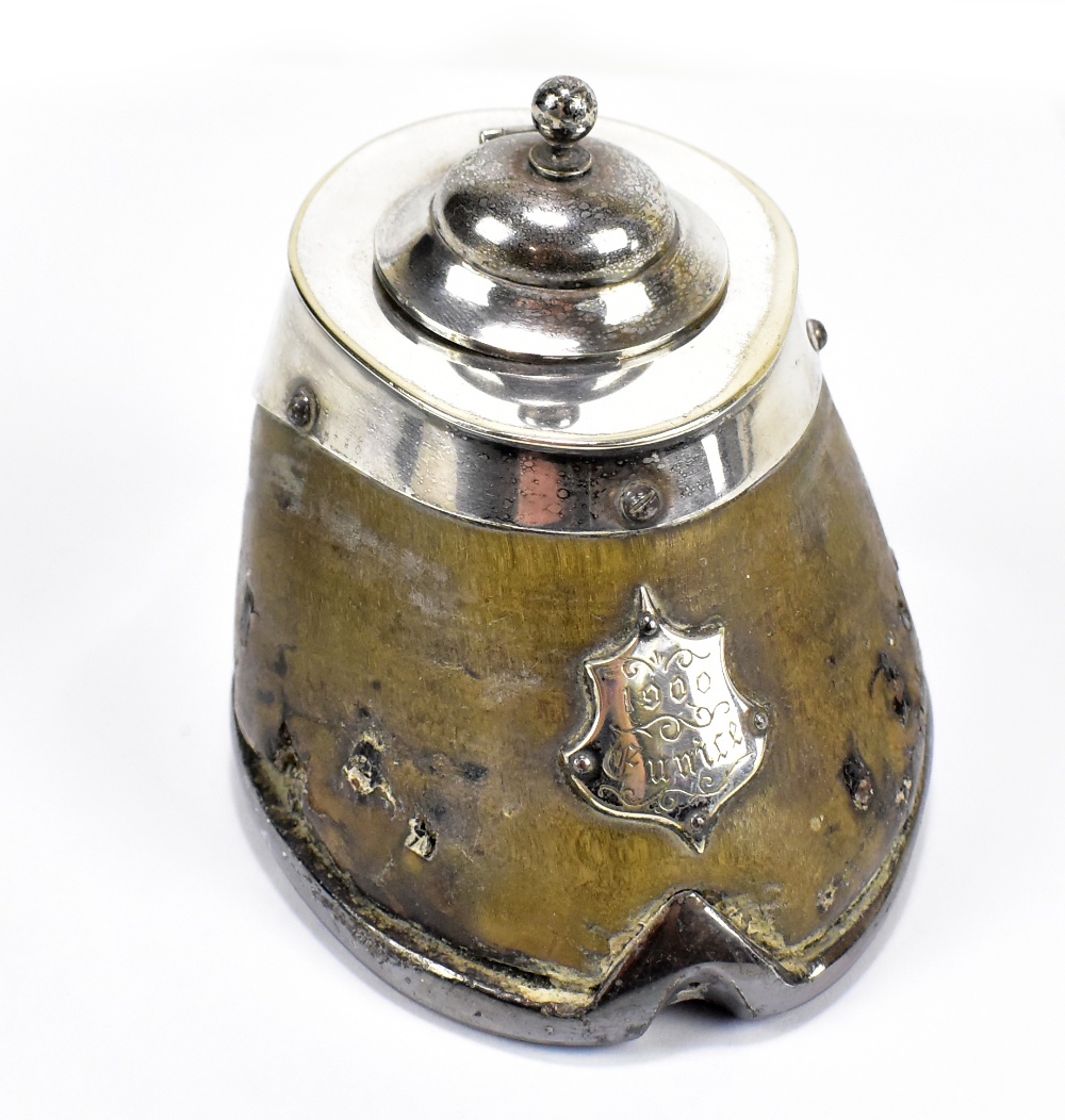 An early 20th century horse hoof inkwell with silver plated mount and shield, height 9cm.