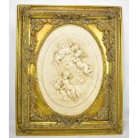 A decorative oval relief decorated cherubic plaque in gilt frame, frame 56 x 46cm.Additional
