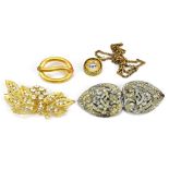 Four items of costume jewellery comprising three brooches, and a compass on a gold plated chain (