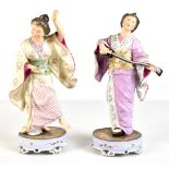 A pair of late 19th century Continental porcelain figures of Japanese women, one dancing with a fan,