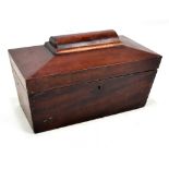 A Victorian mahogany sarcophagus shaped two division tea caddy, length 24cm.