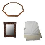 An early 20th century carved oak wall mirror, 64 x 48.5cm, and two further wall mirrors (3).