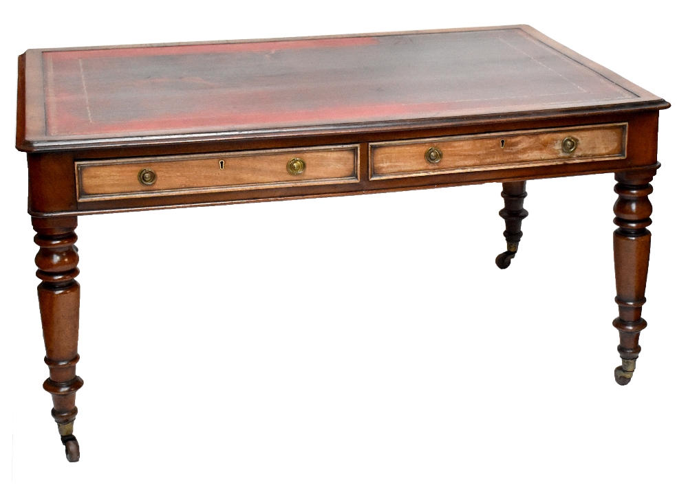 A large Victorian mahogany leather topped partner's writing desk, each side with two drawers to