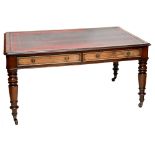 A large Victorian mahogany leather topped partner's writing desk, each side with two drawers to