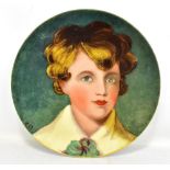 WORCESTER ROYAL PORCELAIN WORKS; a hand painted wall plate depicting a portrait of a boy, signed