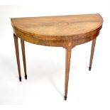 A George III mahogany crossbanded boxwood strung and satinwood inlaid demi-lune card table, raised