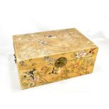 A small Chinese painted rectangular trunk with twin carrying handles, width 64cm.