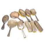 A group of variously mounted silver hallmarked clothes brushes, hair brushes and mirrors (numerous