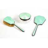 DAVIS, MOSS & CO; a George V hallmarked silver and green gouache enamel two piece dressing table