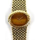 BUECHE-GIROD; a lady's 9ct yellow gold mechanical bracelet watch, the oval dial without numerals (