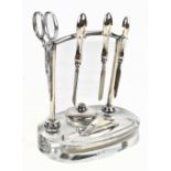 F. H ADAMS & HOLMAN; a George VI hallmarked silver mounted table top vanity set on oval clear
