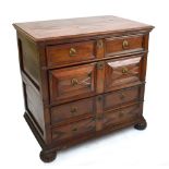 An early 18th century Dutch mahogany and walnut geometrically moulded chest of four long drawers