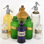 A collection of five assorted pharmaceutical chemist bottles to include blue glass examples with