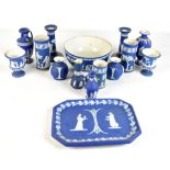 WEDGWOOD; a pair of candlesticks, spill vases, small vases, shaped tray, bowl, etc, all blue