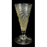 An early 19th century dwarf wrythen ale glass, with twisted glass bowl and broken pontile, height