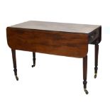 An early 19th century mahogany Pembroke table, the rectangular top with single frieze drawer and