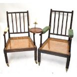 Two Regency period bobbin framed armchairs, one example with detachable brass sconce and mahogany
