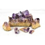 A natural amethyst rock crystal, length 28.5cm (af).