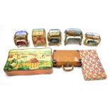 Five glass trinket boxes with gilt metal mounts and scenic views to the tops including the
