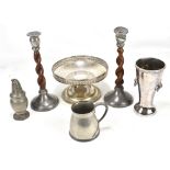 A small group of metalware including a pair of pewter mounted candlesticks, a trumpet vase, a mug,