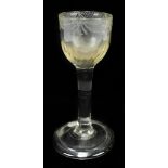 An 18th century engraved wine glass, with folded foot rim and ogee bowl, height 13cm.Additional