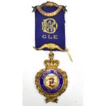 A silver gilt Masonic jewel inscribed 'Justice, Truth, Philanthropy, St Ogg's Lodge 947'.