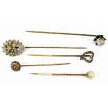 Five stick pins to include a 9ct yellow gold example with base metal pin, etc (5).