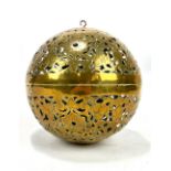 A pierced brass foliate motif hand warmer with original internal gimbal, diameter approx 15cm.