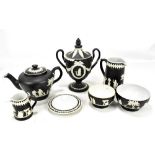 WEDGWOOD; a small group of black basalt items to include a teapot on stand, a lidded urn (af),