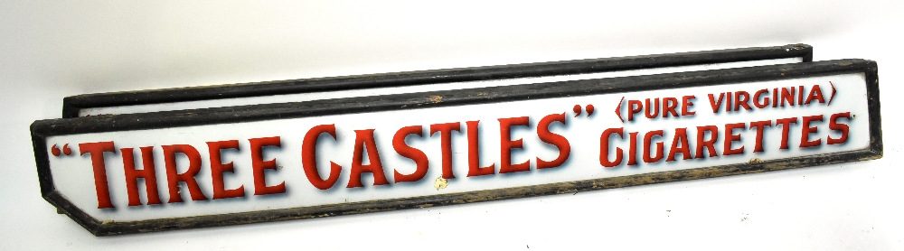 An original enamel advertising sign inscribed 'Three Castles, Pure Virginia Cigarettes', inset in