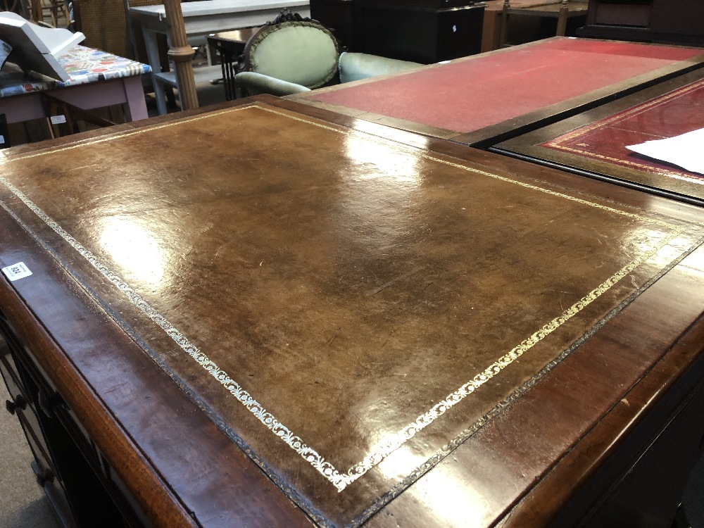 A mahogany twin pedestal desk with inset gilt tooled leather top above arrangement of nine - Bild 2 aus 6