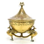 A South East Asian pierced brass potpourri bowl, the lid finial featuring two birds and with pierced