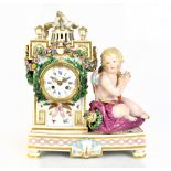 A late 19th century Continental porcelain mantel clock, the circular white enamel dial inscribed '