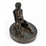 A small bronze figure of a seated satyr on circular base, apparently unmarked, height 7cm.Additional