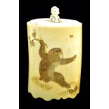 A Japanese Meiji period carved ivory brush pot featuring three monkeys chasing insects, signed