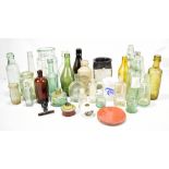A quantity of vintage glass bottles, also a stoneware ginger beer bottle, jars, etc.