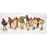 A group of twelve early 20th century Krishnanagar clay figures modelled in various poses and