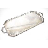 ELKINGTON & CO; an Elizabeth II hallmarked silver twin handled rectangular tray of shaped outline,