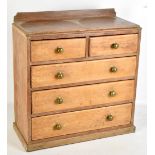 An early 20th century pitch pine miniature apprentice chest of two short over three long drawers,