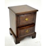 A small oak two drawer chest on bracket feet, 50 x 35.5 x 33cm. Additional Informationchips,